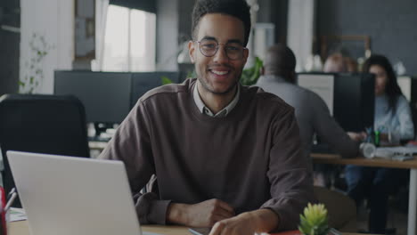 happy african american man at his workplace