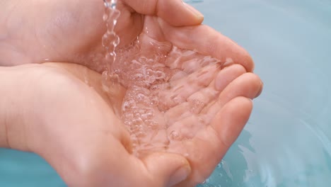 water pouring into hands