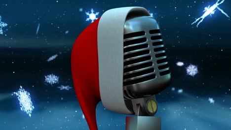 Animation-of-snow-falling-over-microphone-with-christmas-hat-on-dark-background