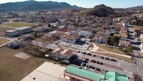 Aerial-forward-view-over-a-bell-tower-and-city-of-Onigo