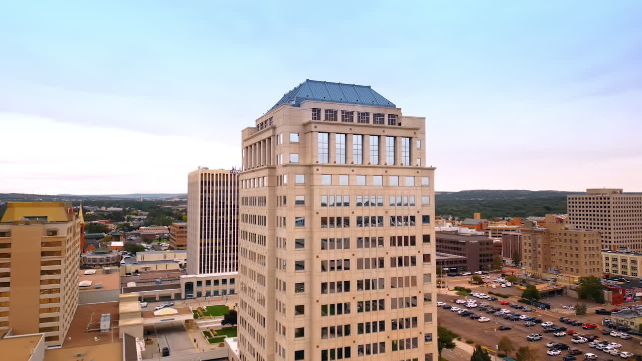 Colorado Springs, USA, 22 July 2025: Beautiful high-rise modern building with a blue roof. Drone flight around Wells Fargo Tower in Colorado-Springs, Colorado, USA