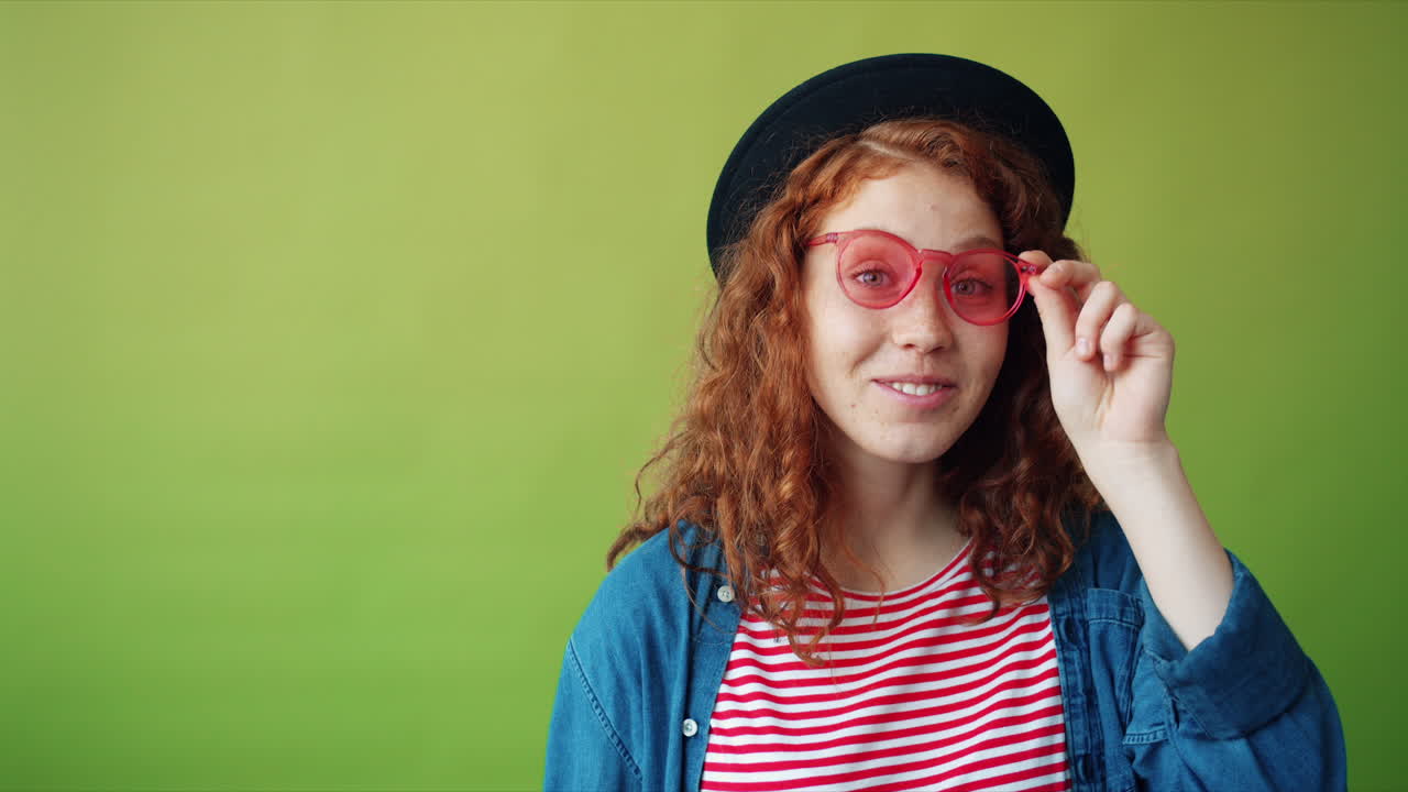Smiling Woman with Red Sunglasses and Hat