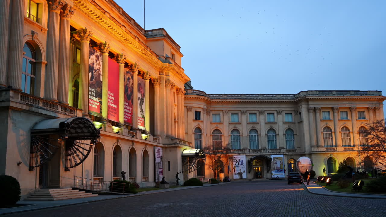 Bucharest, Romania - December 14, 2021: Street view of the Royal Palace of Bucharest in the evening
