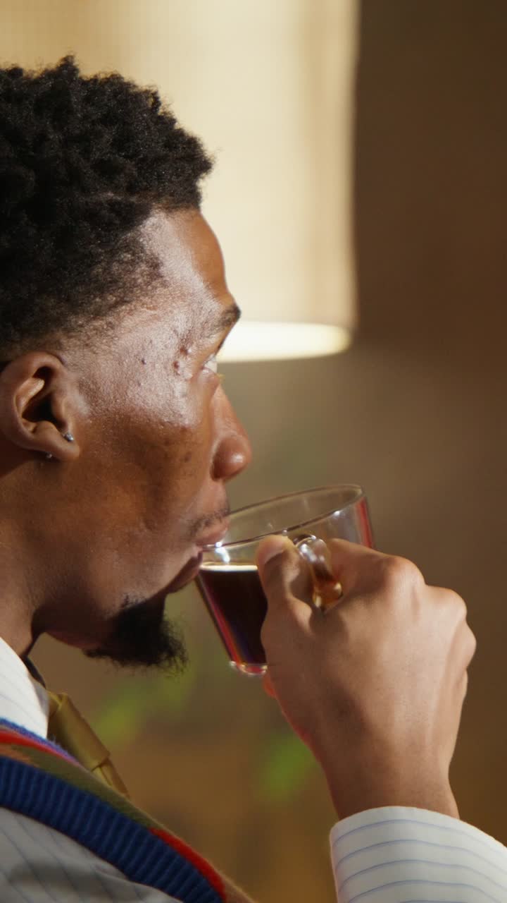 Man drinking coffee at home