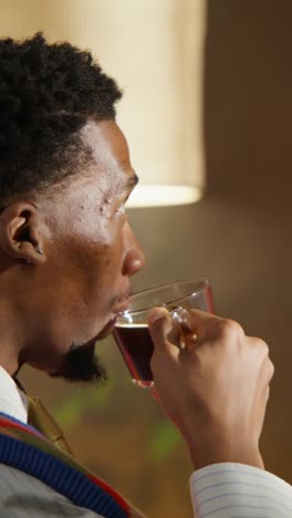 man drinking coffee at home