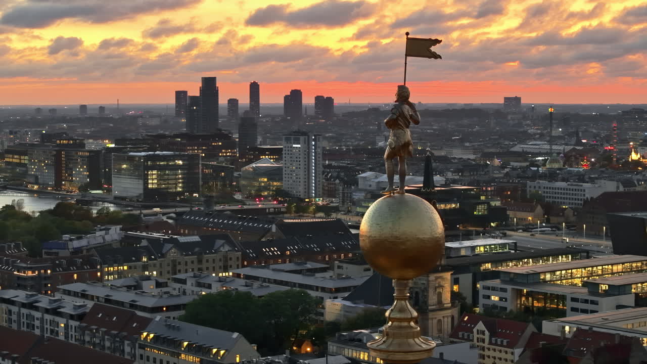 Aerial drone view of the top of the Church of Our Saviour in the city centre of Copenhagen, Denmark at sunset