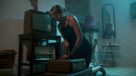 vintage retro woman in a room with a suitcase