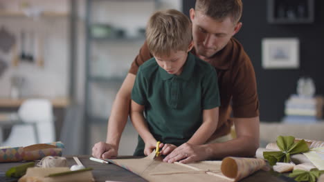 father and son crafting together