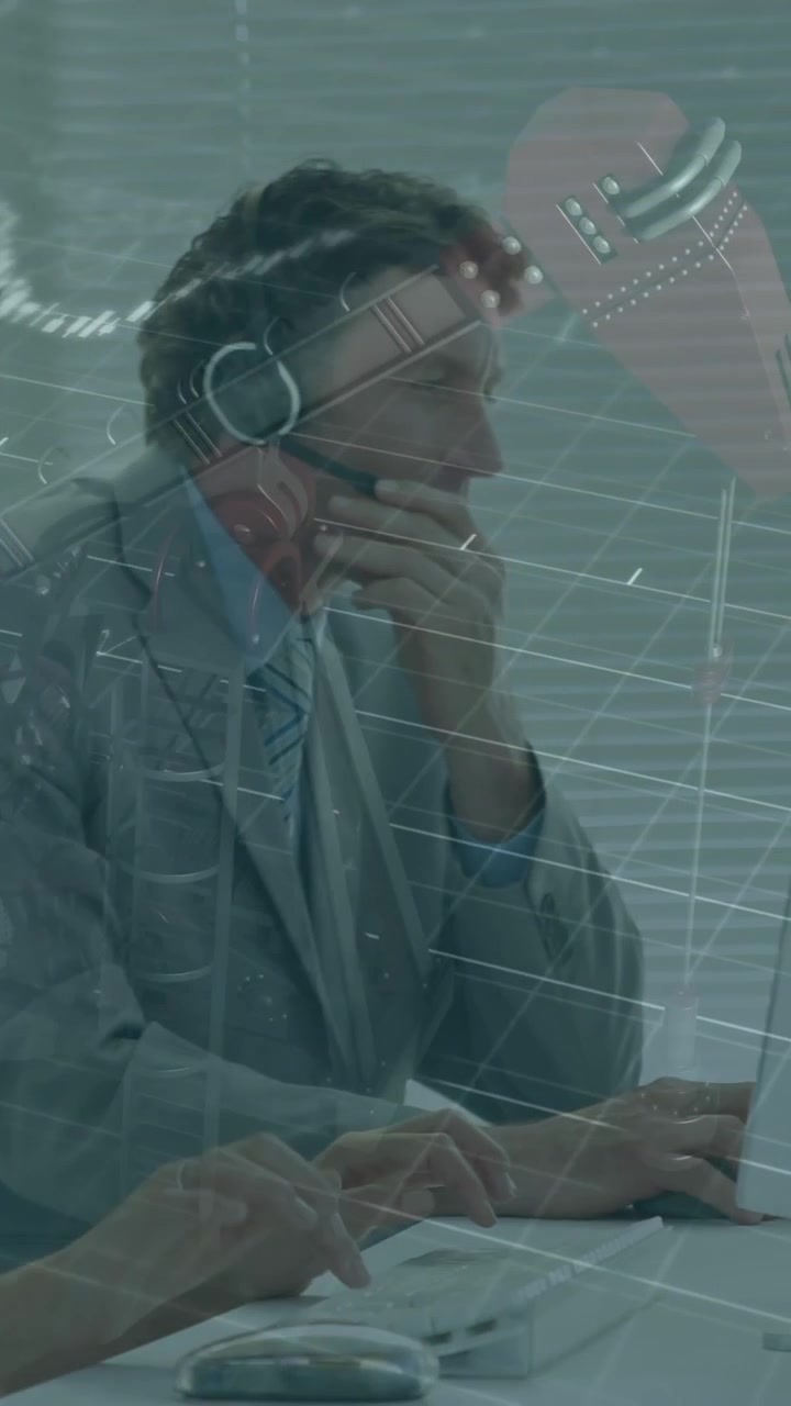 Business professionals working at computers with financial data animation overlay