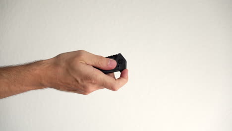 hand showing how to use a retractable pocket knife