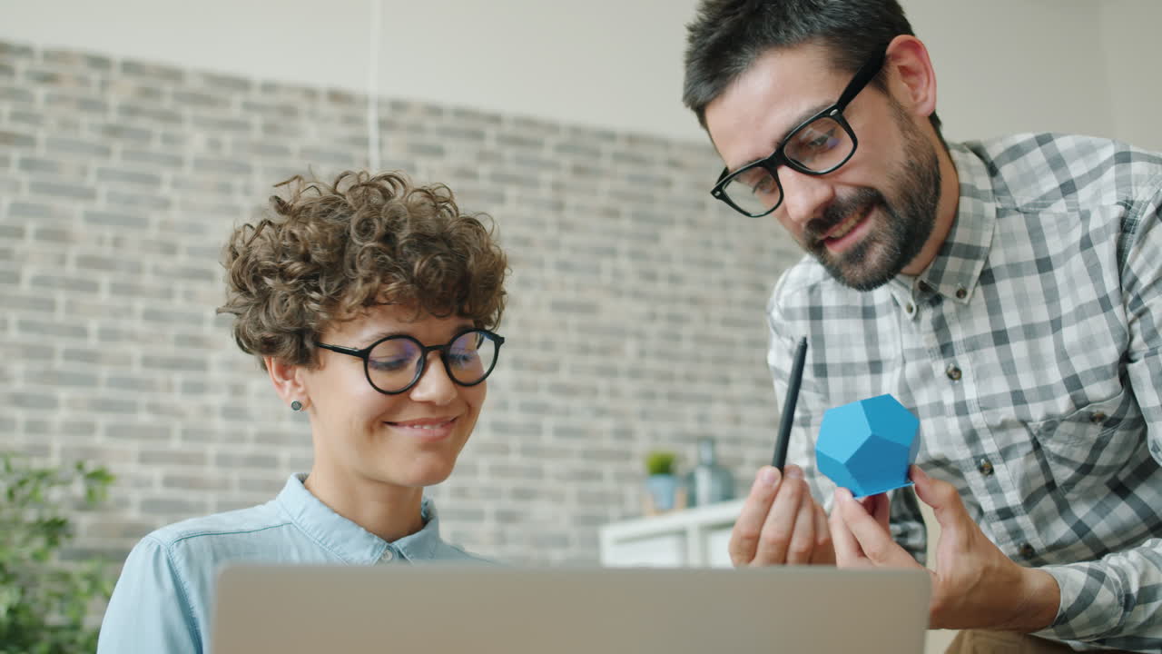 Business meeting or collaboration session with geometric model