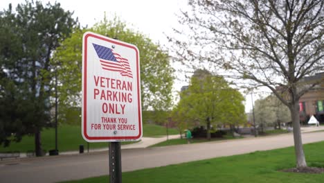 veterans parking only sign with american flag