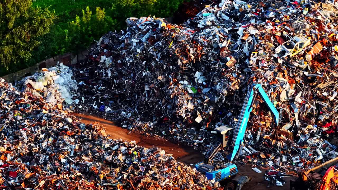 Aerial view of a massive landfill site with recycling machinery working