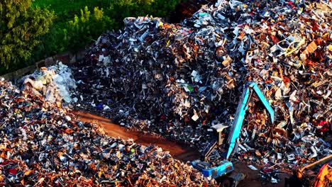 aerial view of a massive landfill site with recycling machinery working