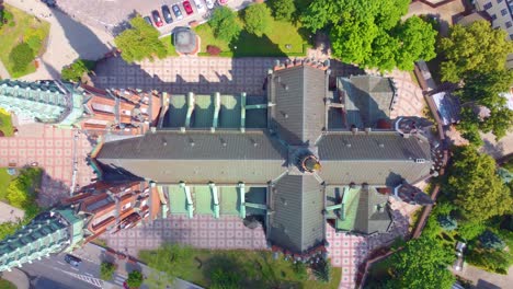 tall tower and majestic church rooftop, aerial top down view