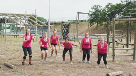 female friends enjoying exercising at boot camp together