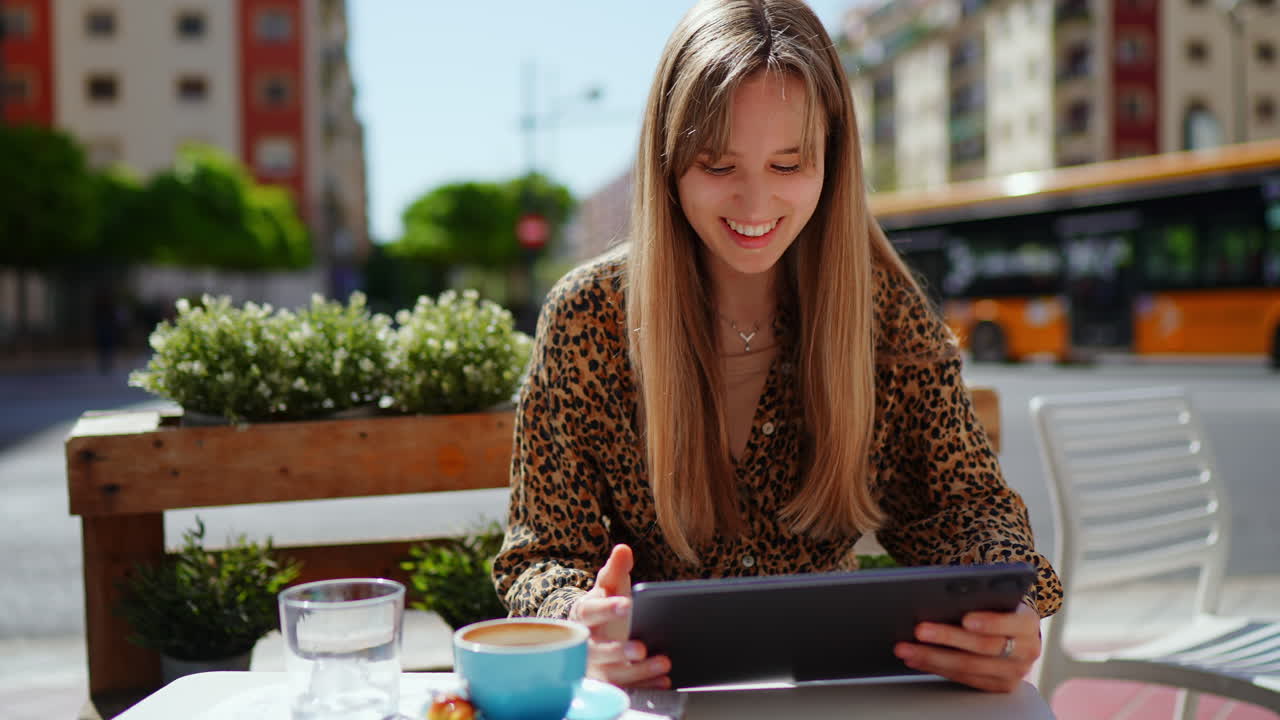 Woman using tablet in a cafe