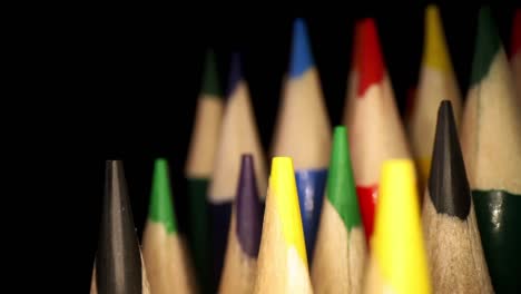 panning-right-past-colored-pencils,-since-the-lens-is-so-close-it-looks-like-lens-is-wrapping-around-pencils-as-a-whole-set