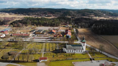 aerial - björketorps church and burial ground, rävlanda, sweden, wide shot