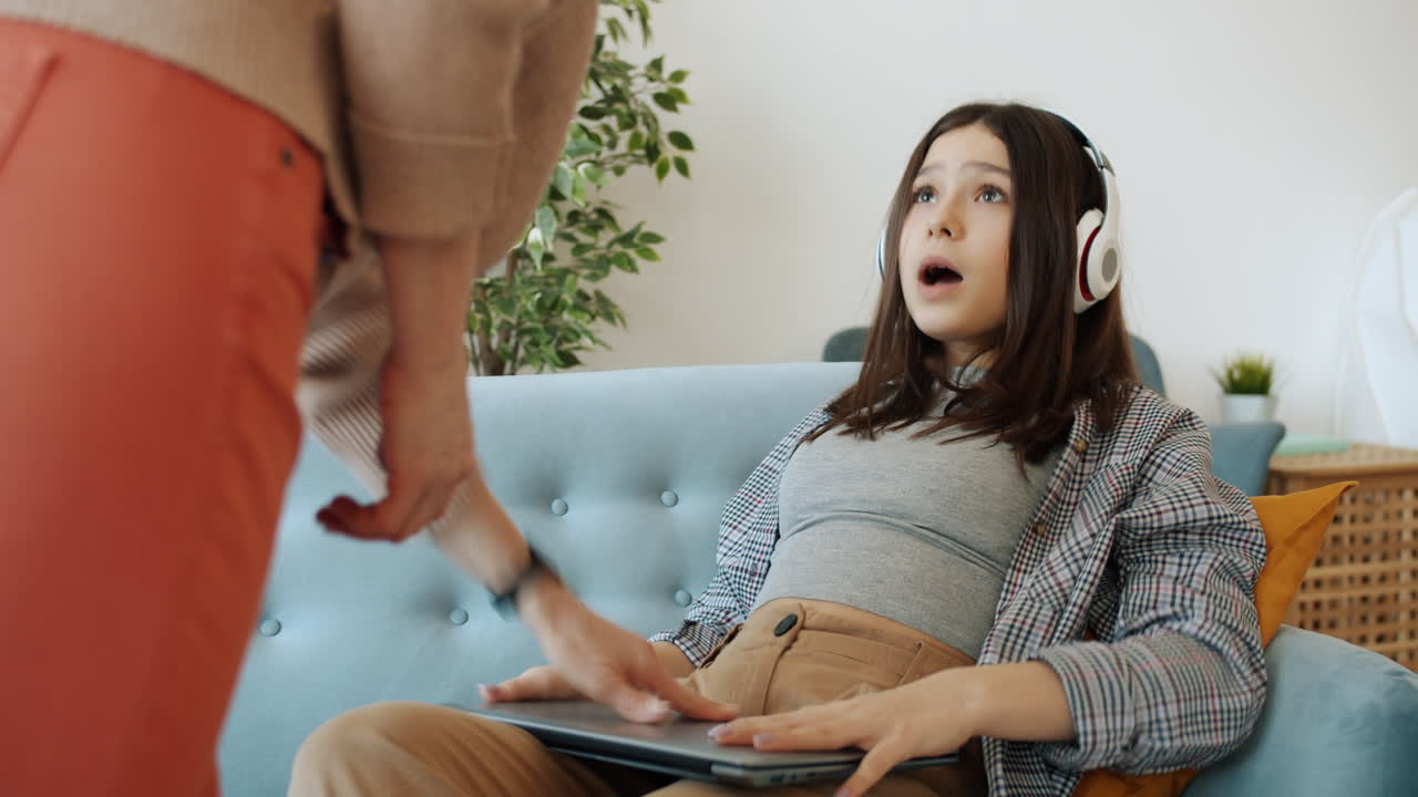 Teenage Girl Learning at Home with Mom