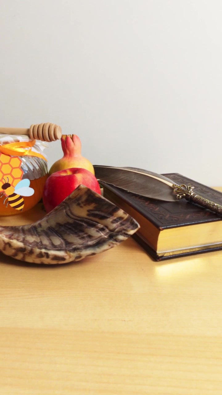 Traditional rosh hashanah symbols on a table