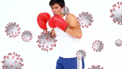 Animation-of-virus-cells-floating-over-mixed-race-man-boxing