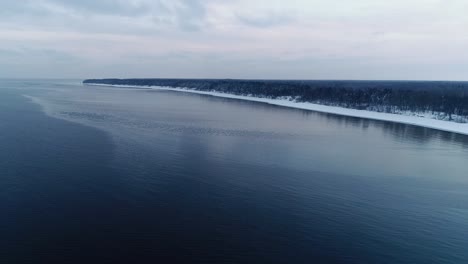 frozen snowy seashore on a cold winter day