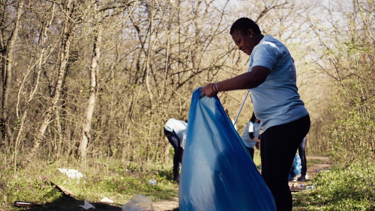 African american activist doing litter cleanup to fight illegal dumping