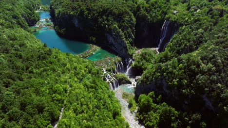 panorama of plitvice lakes national park lower lakes with waterfalls and dense green forest in croatia. - aerial shot