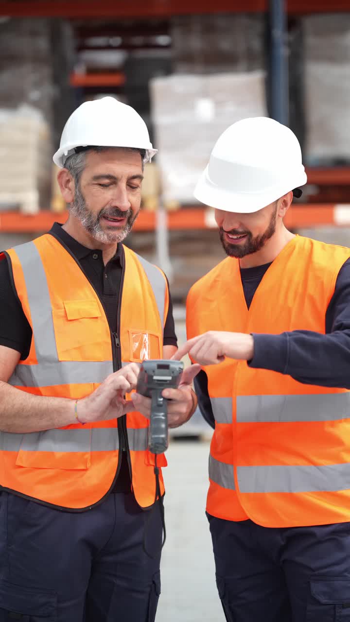 Warehouse Workers Using Barcode Scanner for Inventory Management