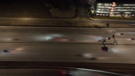 nighttime highway traffic - tilt down aerial hyper lapse