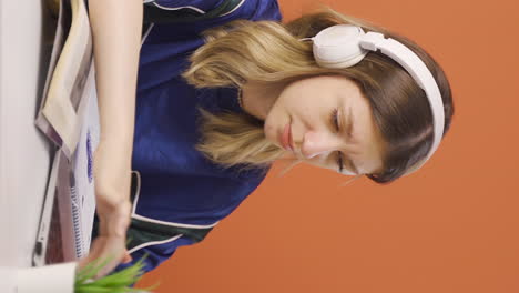 Vertical-video-of-The-young-woman-who-can't-use-the-application-on-the-laptop.