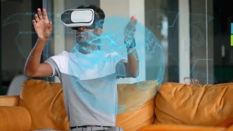 Animation-of-rotating-globe-and-data,-over-man-in-vr-headset-gesturing-in-virtual-interface