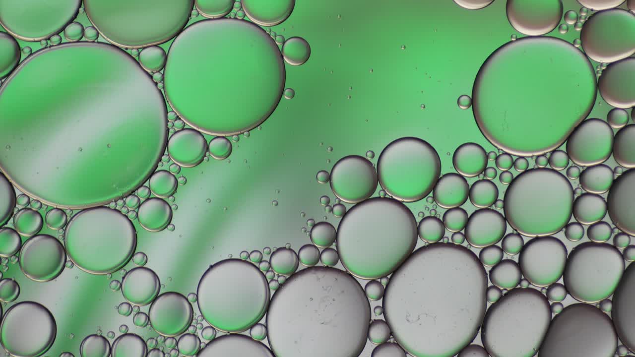물 위에 떠다니는 기름방울의 다채로운 예술적. 추상적인 거품 배경