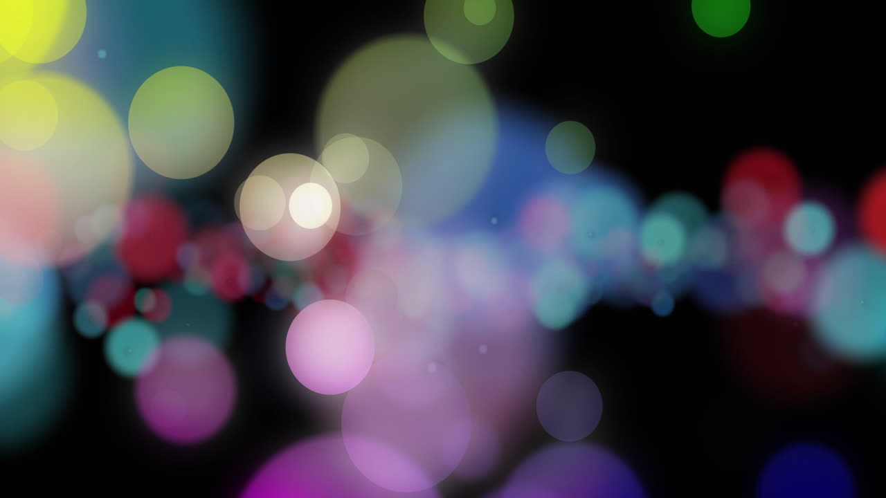 Animation of flashing multi coloured lights on black background
