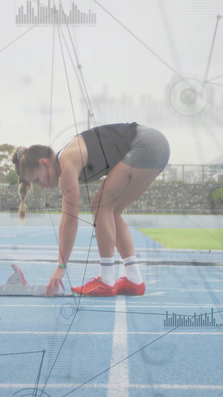 Vertical video: Woman runner adjusting blocks, standing on track, HUD overlays guiding sports start