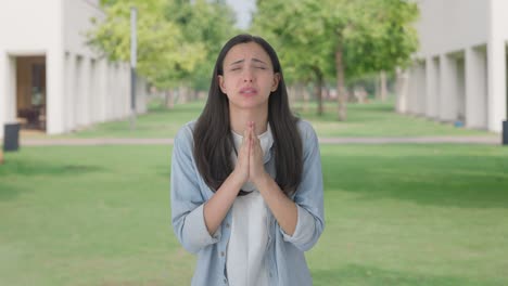 scared indian girl praying to god