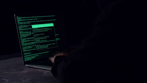 hacker using laptop computer hacking