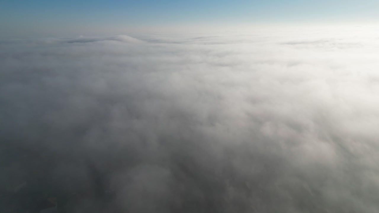 Fast moving rolling fog over a housing estate