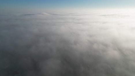 fast moving rolling fog over a housing estate