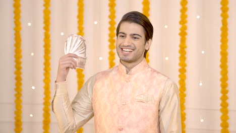 Indian-man-enjoying-with-money-on-Diwali