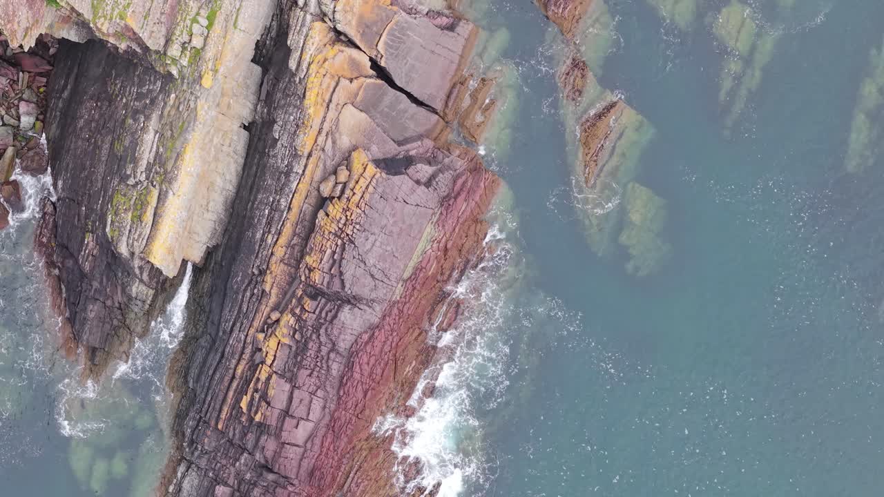 Power of the Atlantic Ocean Waves Crashing Against Rugged Rocks in County Cork, Ireland