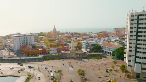 aerial drone shot of the walled city of cartagena entrance, clock tower, colombia