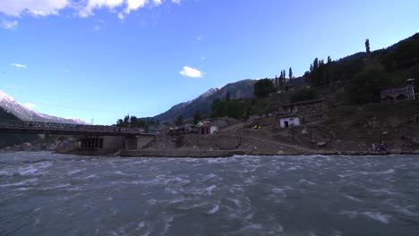 river swat flowing under a bridge in kpk