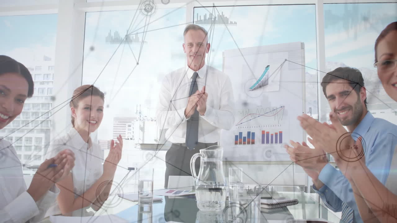 Business team clapping in office with data network animation overlay