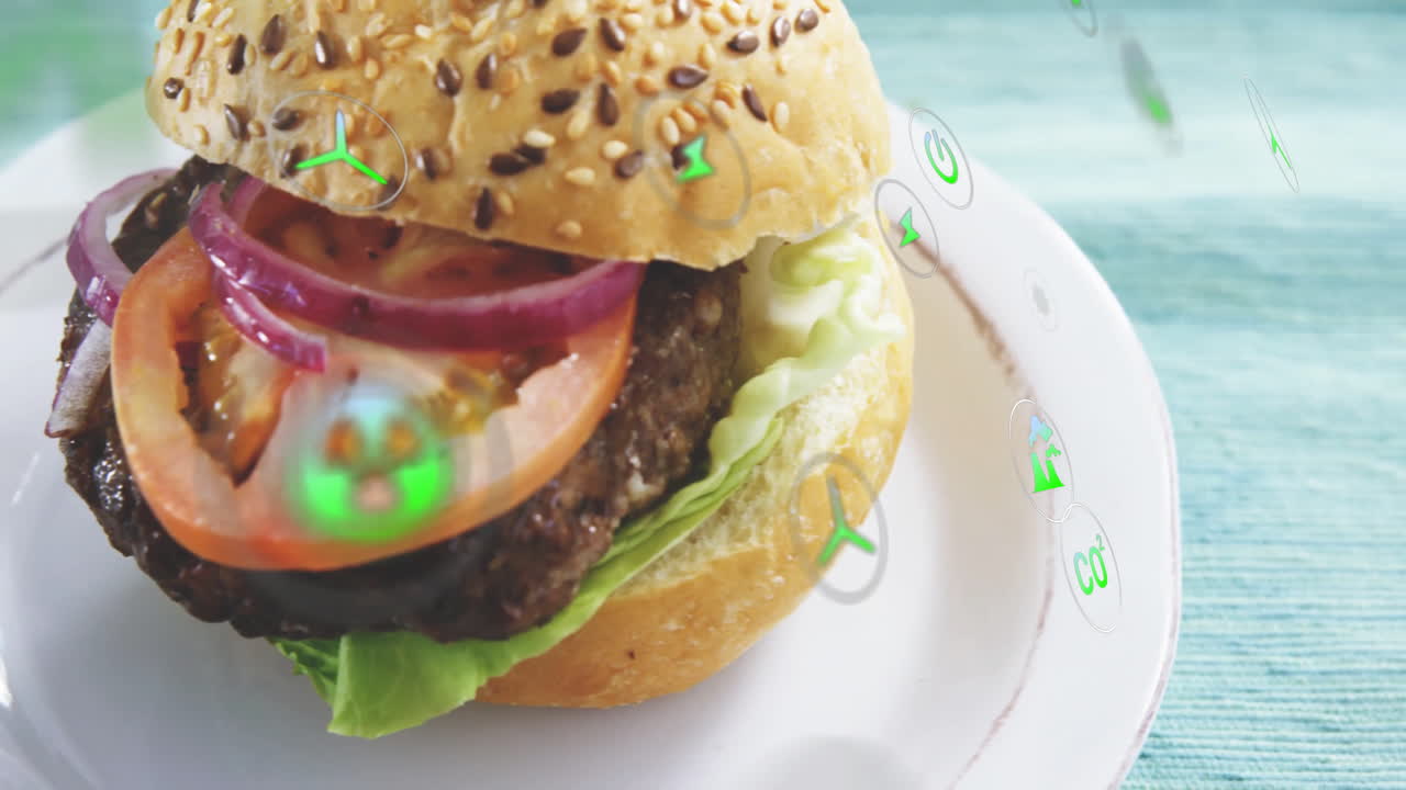 Juicy burger with lettuce, tomato, and onion over digital animation elements