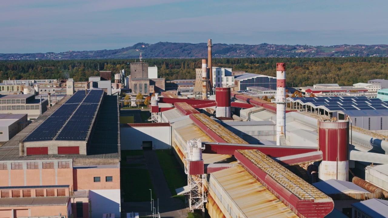 The aerial view shows an aluminum factory and industrial complex with buildings and manufacturing