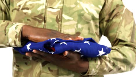 portrait of military soldier holding us flag