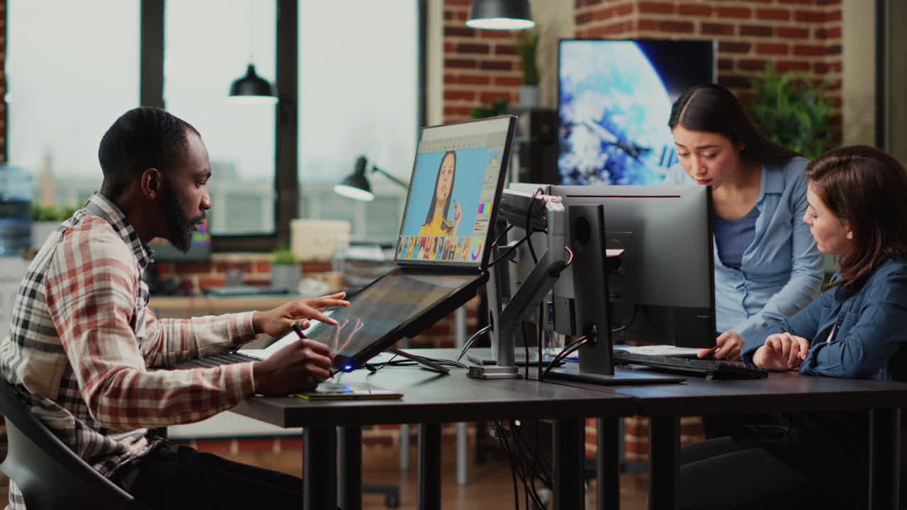 Male graphic designer editing pictures on retouching software