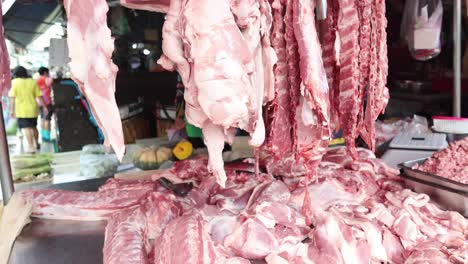 ground meat being shaped into a long strip